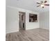 Bright open-concept living room with hardwood floors and views into the kitchen at 709 Wickham Ridge Rd, Apex, NC 27539