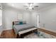 This spacious bedroom offers hardwood floors, a ceiling fan, and ample natural light at 715 Kimbrough St, Raleigh, NC 27608
