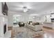 Spacious living room with hardwood floors, fireplace, and a seamless transition to the kitchen area at 715 Kimbrough St, Raleigh, NC 27608