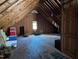 Spacious attic with plywood flooring and exposed beams, offering potential for storage or conversion at 7401 Walnut Grove Ln, Zebulon, NC 27597