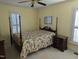 Bedroom features traditional furniture, colorful bedding, and bright windows at 7401 Walnut Grove Ln, Zebulon, NC 27597