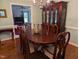 Dining room features a large table and chairs plus a china cabinet for storage and display at 7401 Walnut Grove Ln, Zebulon, NC 27597
