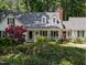 Attractive two-story home boasting a manicured front lawn, dormer windows, and a welcoming porch at 7401 Walnut Grove Ln, Zebulon, NC 27597
