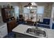 Eat-in kitchen featuring wood table, ceiling fan, and large windows at 7401 Walnut Grove Ln, Zebulon, NC 27597