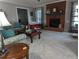 Spacious living room boasts comfortable seating, a brick fireplace, and stylish decor at 7401 Walnut Grove Ln, Zebulon, NC 27597