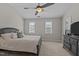 Spacious bedroom features neutral walls, a ceiling fan, and two large windows at 831 S White St, Wake Forest, NC 27587