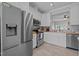 Modern kitchen featuring stainless steel appliances, white cabinetry, and butcher block countertops at 831 S White St, Wake Forest, NC 27587