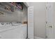 Laundry room with white washer and dryer at 831 S White St, Wake Forest, NC 27587