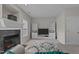 Living room features fireplace, built-in shelves, and a flat screen television at 831 S White St, Wake Forest, NC 27587