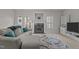 Cozy living room features fireplace, neutral walls, and a comfortable gray sofa at 831 S White St, Wake Forest, NC 27587