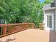 A spacious backyard deck with decorative railings offers great space for outdoor gatherings at 102 Downing Forest Pl, Cary, NC 27519