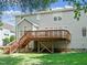 A backyard deck with stairs leading down to the yard at 102 Downing Forest Pl, Cary, NC 27519