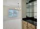 Bar area with mirrored backsplash next to formal living area at 102 Downing Forest Pl, Cary, NC 27519