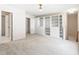 Bonus room with carpet, storage shelving, and doors leading to other areas at 102 Downing Forest Pl, Cary, NC 27519