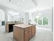 Bright open kitchen features an island, lots of cabinets, and views to multiple rooms at 102 Downing Forest Pl, Cary, NC 27519