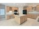 Open kitchen featuring an island, lots of cabinet space, and modern appliances at 102 Downing Forest Pl, Cary, NC 27519