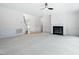Spacious living room features fireplace, and transitions to other rooms in the house at 102 Downing Forest Pl, Cary, NC 27519