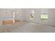 The large living room with neutral carpet has a view into the dining room and features a front entryway at 102 Downing Forest Pl, Cary, NC 27519