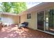 Back deck features a seating area and door to inside of house at 103 Westview Dr # Apt K, Carrboro, NC 27510