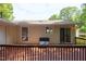 Relaxing back deck with an outdoor seating area and views of the yard at 103 Westview Dr # Apt K, Carrboro, NC 27510