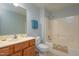 Bathroom features a vanity with drawers, toilet, and bathtub with shower at 103 Westview Dr # Apt K, Carrboro, NC 27510