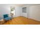 Bright bedroom features beautiful laminate flooring with washer and dryer in closet at 103 Westview Dr # Apt K, Carrboro, NC 27510