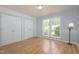 Bedroom features laminate flooring, two large window, and double closets at 103 Westview Dr # Apt K, Carrboro, NC 27510