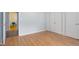 Bedroom features laminate flooring, neutral walls, and bright lighting at 103 Westview Dr # Apt K, Carrboro, NC 27510
