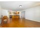 Open-concept dining and kitchen area boasting stainless steel appliances, and new flooring at 103 Westview Dr # Apt K, Carrboro, NC 27510
