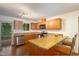 Well-lit kitchen featuring wood cabinets, stainless steel appliances, and an eat-in countertop at 103 Westview Dr # Apt K, Carrboro, NC 27510