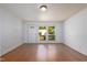 Spacious living room filled with natural light from large windows and showcasing newly refinished hardwood floors at 103 Westview Dr # Apt K, Carrboro, NC 27510