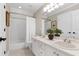 Bathroom featuring double sinks, an ornate mirror, and a tub with shower at 105 Bardsey Ct, Cary, NC 27513