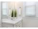 Bathroom featuring a large mirror and a plant on a bright, sunny day at 105 Bardsey Ct, Cary, NC 27513
