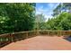 Spacious wooden deck bordered by lush greenery creates a private oasis at 105 Bardsey Ct, Cary, NC 27513