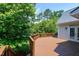 A wood deck provides a peaceful outdoor space surrounded by trees at 105 Bardsey Ct, Cary, NC 27513