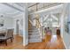 Open-concept foyer boasts hardwood floors, staircase, and access to the dining room at 105 Bardsey Ct, Cary, NC 27513