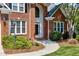 Beautiful brick home featuring a walkway, well-maintained landscaping, and an elegant entrance at 105 Bardsey Ct, Cary, NC 27513
