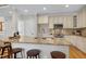 Kitchen island features granite countertops and stainless steel appliances at 105 Bardsey Ct, Cary, NC 27513