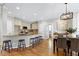 Eat-in kitchen featuring an island, bar stool seating, and wooden cabinets at 105 Bardsey Ct, Cary, NC 27513