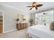 Bright main bedroom features a ceiling fan, neutral walls, and lots of natural light at 105 Bardsey Ct, Cary, NC 27513