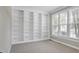 Cozy room with built-in bookshelves and a window providing ample natural light at 105 Bardsey Ct, Cary, NC 27513