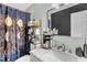 Renovated bathroom featuring a sink, vanity, and decorative shower curtain at 106 Blackfoot Dr, Louisburg, NC 27549