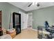 Bedroom includes an open closet, desk, and neutral colored walls at 106 Blackfoot Dr, Louisburg, NC 27549