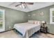 The bedroom features natural light, neutral paint, and a plush queen bed with cozy pillows at 106 Blackfoot Dr, Louisburg, NC 27549