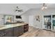 Kitchen island with seating overlooks the living room and dining area, perfect for entertaining at 106 Blackfoot Dr, Louisburg, NC 27549
