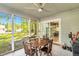Sunroom with tile flooring, ceiling fan, and scenic outdoor views at 106 Blackfoot Dr, Louisburg, NC 27549