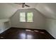 Bonus room offering natural light from windows and wood floors at 108 Horseman Dr, Louisburg, NC 27549