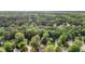 An aerial view shows the home nestled amongst mature trees in a charming neighborhood at 11 Bridgeport Dr, Durham, NC 27713