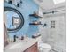 Modern bathroom featuring a stylish sink, toilet, and a shower with glass doors and decorative tiles at 11 Bridgeport Dr, Durham, NC 27713