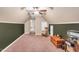 Spacious bonus room featuring a rocking chair and ample space for various activities at 11 Bridgeport Dr, Durham, NC 27713